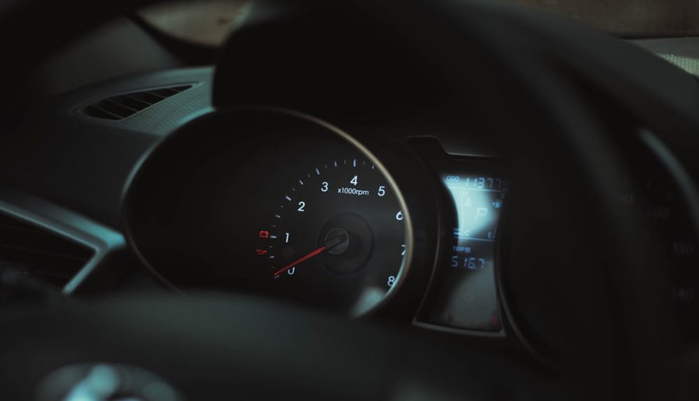 Interior of a car showing a detailed view of the speedometer and tachometer gauges.