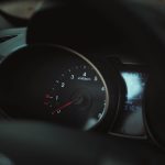 Interior of a car showing a detailed view of the speedometer and tachometer gauges.