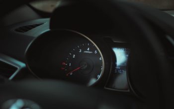 Interior of a car showing a detailed view of the speedometer and tachometer gauges.
